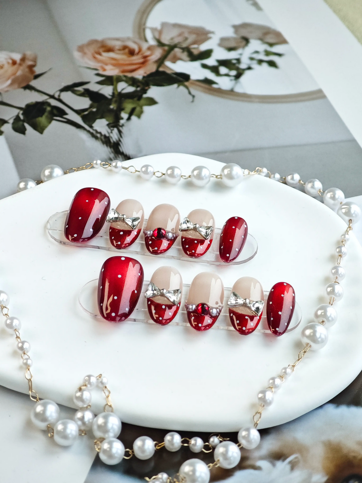 Red Polka‑Dot Silver Bow French Medium Almond Nails