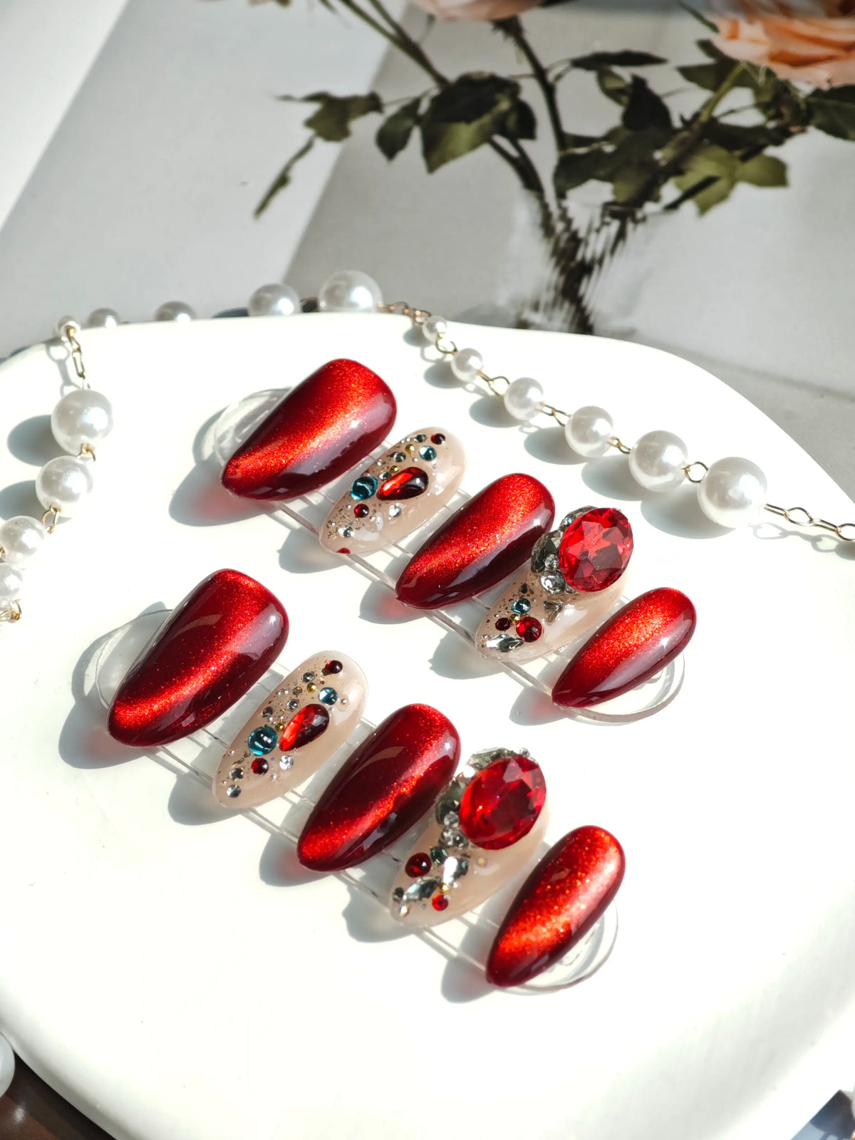 Red Cat‑Eye Multi‑Gem Medium Almond Nails