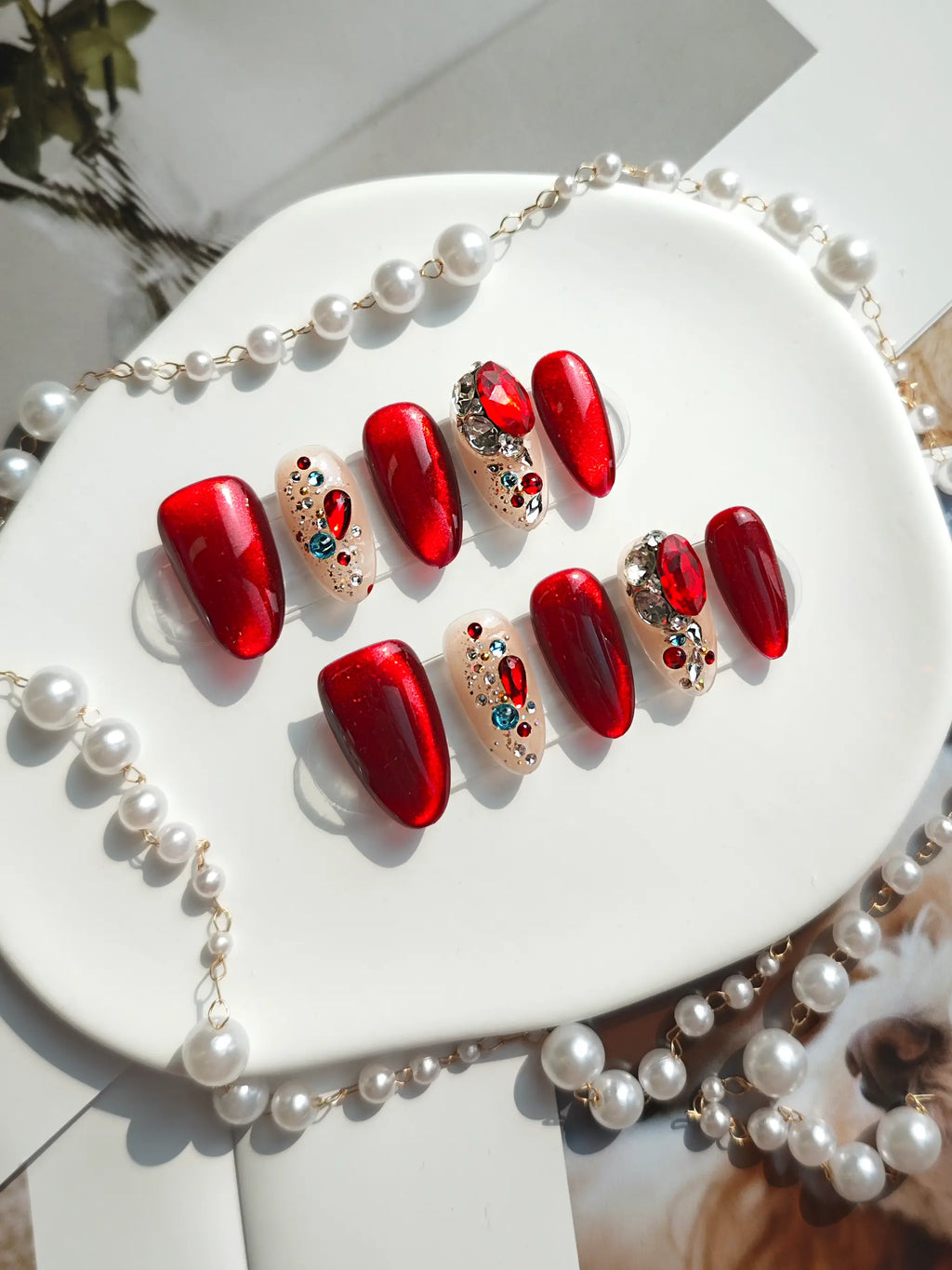Red Cat‑Eye Multi‑Gem Medium Almond Nails