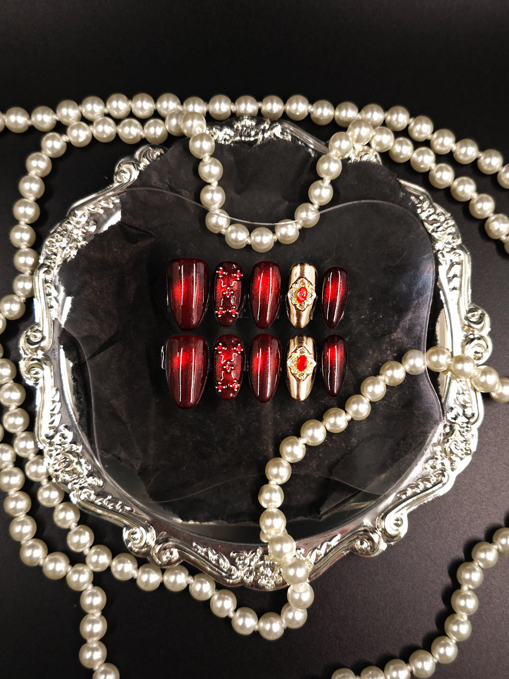 Burgundy Red Cat‑Eye Ornate Gold Gem Medium Almond Nails
