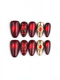 Burgundy Red Cat‑Eye Ornate Gold Gem Medium Almond Nails